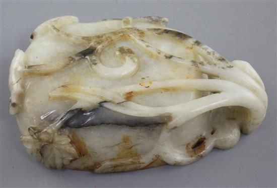 A Chinese white and grey jade brushwasher, 16th / 17th century, length 11.3cm